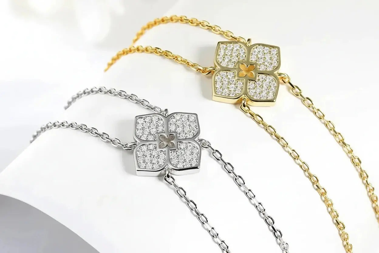 Silver floral moissanite pendant necklace by Zethech with sparkling gemstone and intricate floral design.
