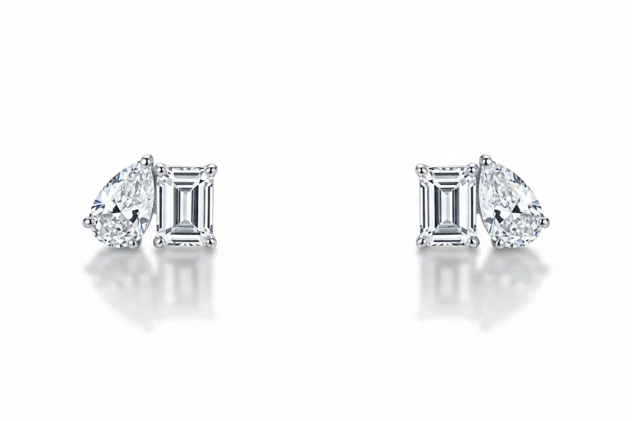 Silver Zethech moissanite teardrop stud earrings with pear-cut design, elegant and sparkling jewelry for special occasions.