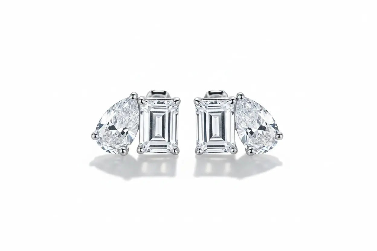 Silver Zethech Majestic Teardrop Pear Cut Moissanite Stud Earrings with sparkling gemstone design.
