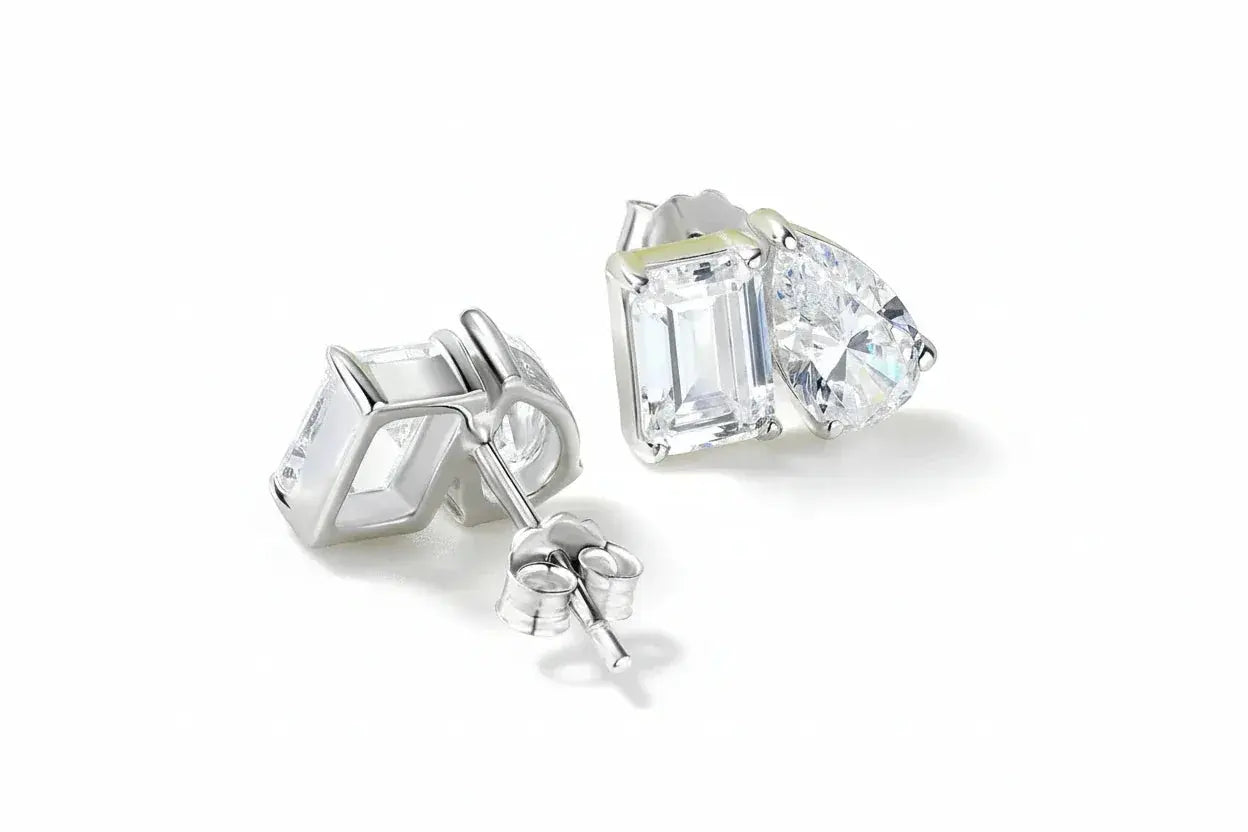Silver Zethech Majestic Teardrop Pear Cut Moissanite Stud Earrings showcasing sparkling pear-shaped stones on a sleek silver setting
