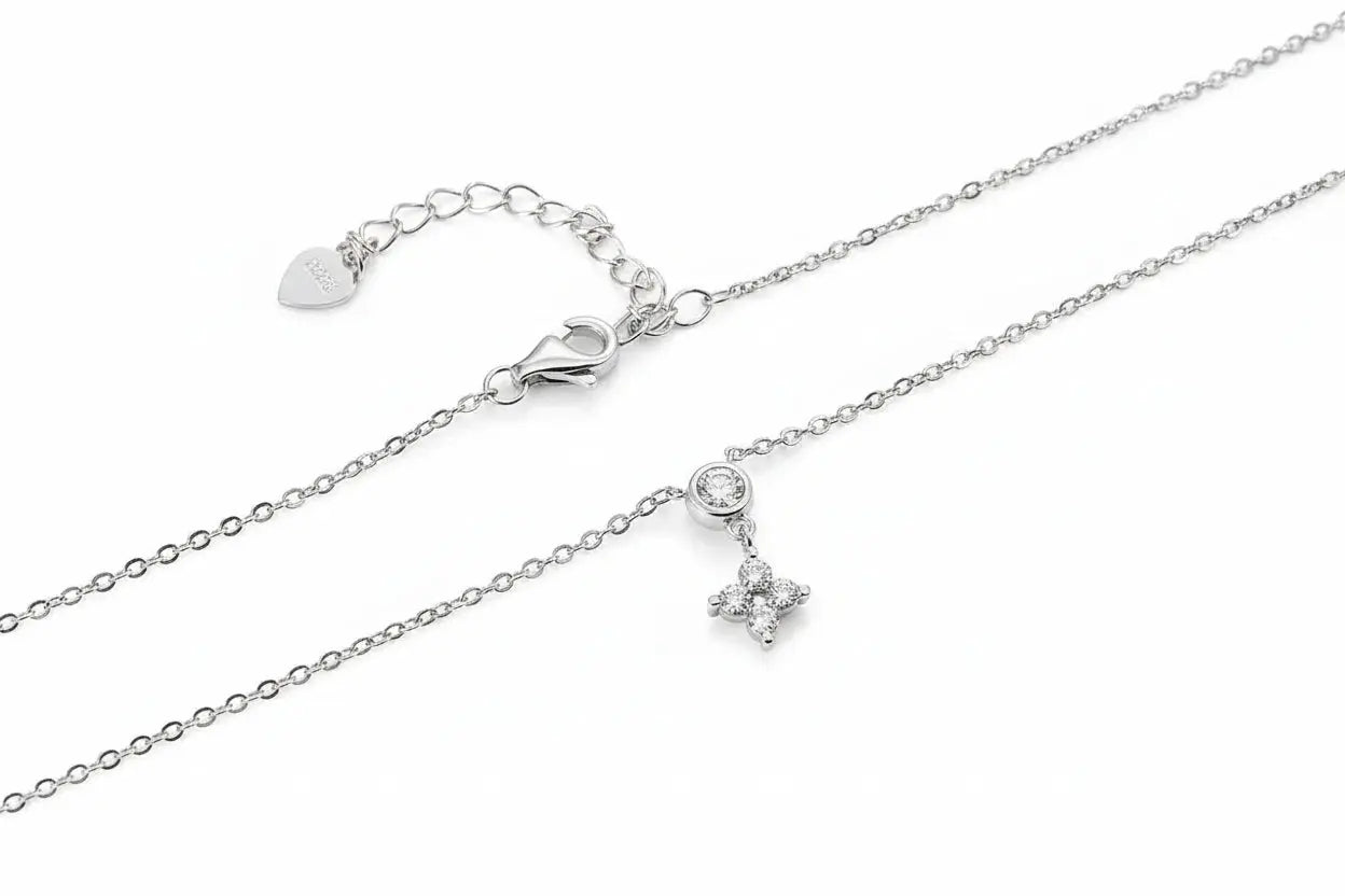 Zethech KNOBSPIN moissanite necklace featuring a four-leaf clover diamond pendant in white gold, sterling silver, 18k dainty jewelry